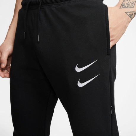 Pantaloni tuta Sportswear Swoosh colore Nero Bianco - Nike - SportIT.com